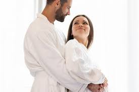 man and woman hugging