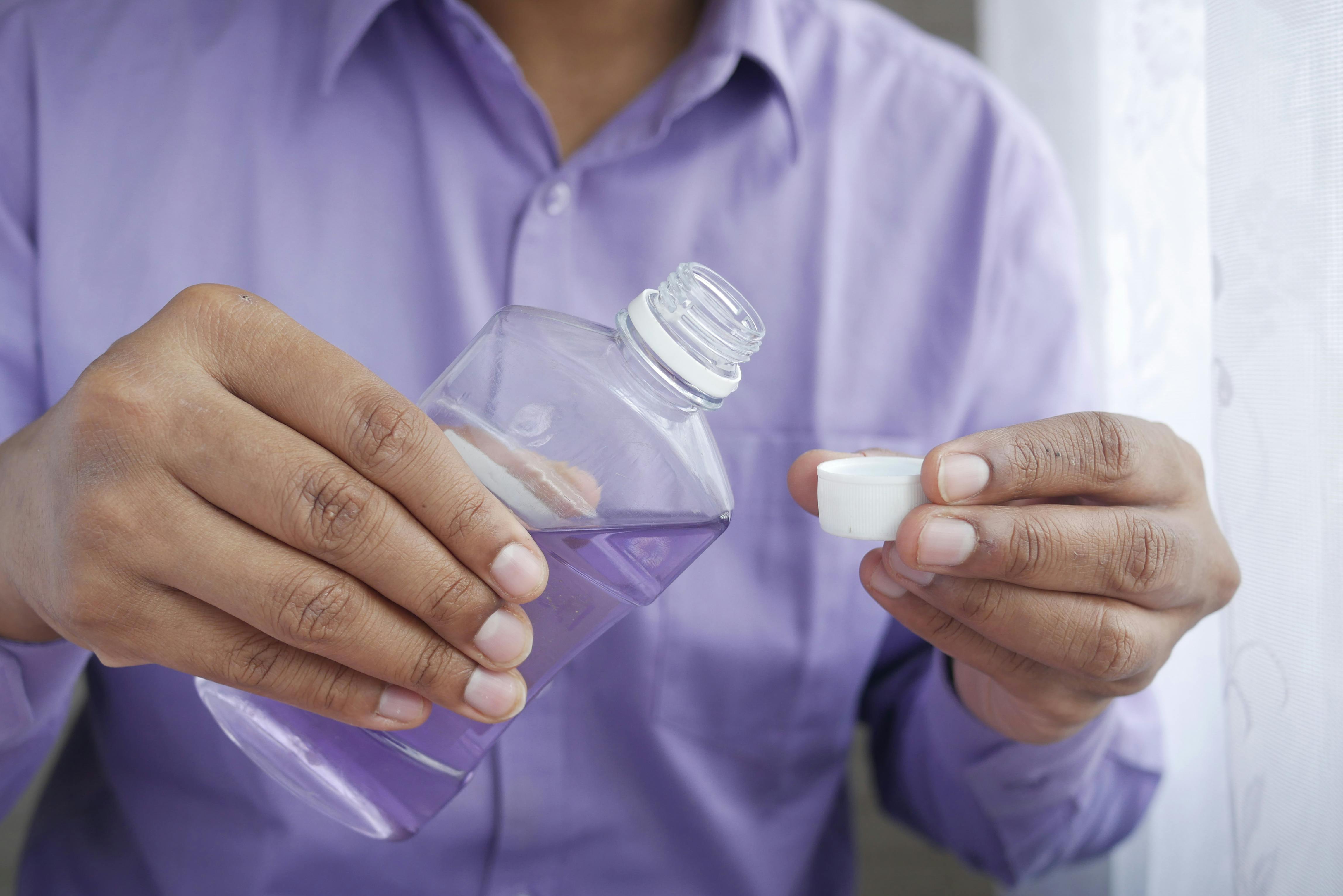 boy using mouth wash