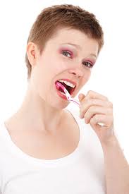woman brushing teeth