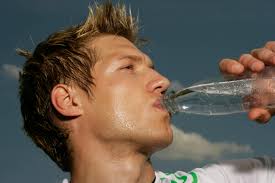 man drinking bottled water