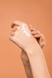 applying cream on hand 