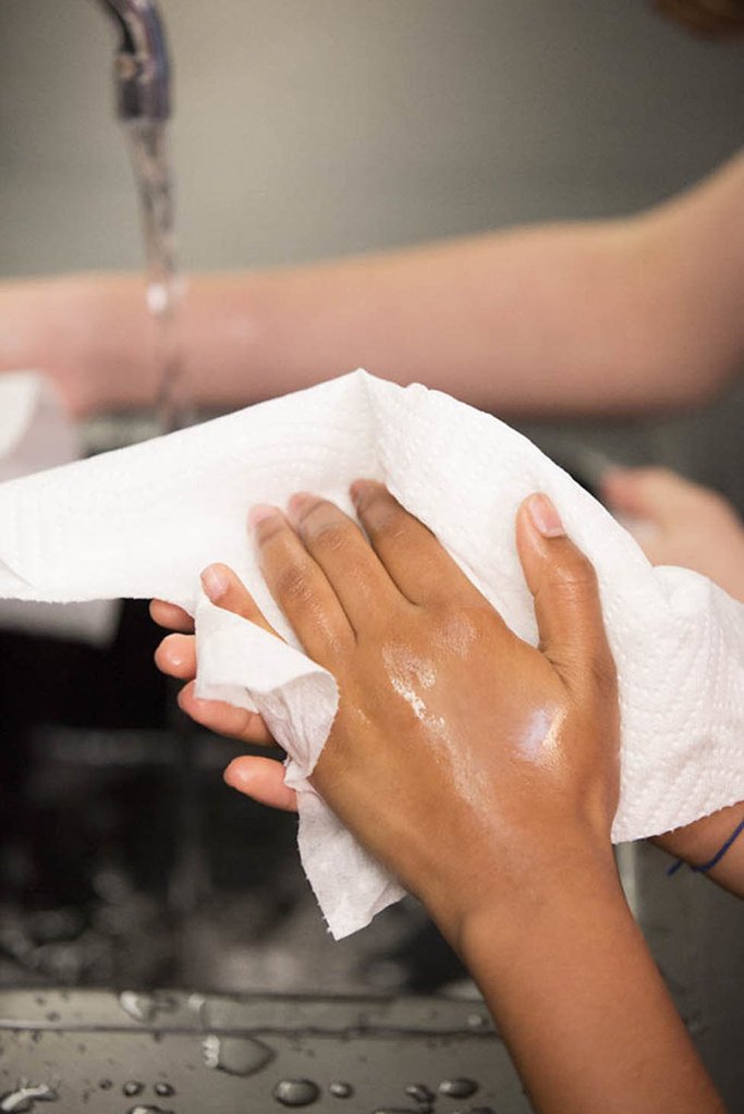 drying hand with clean paper towel