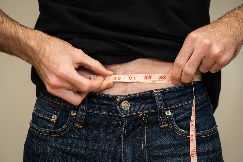tape measure across abdomen