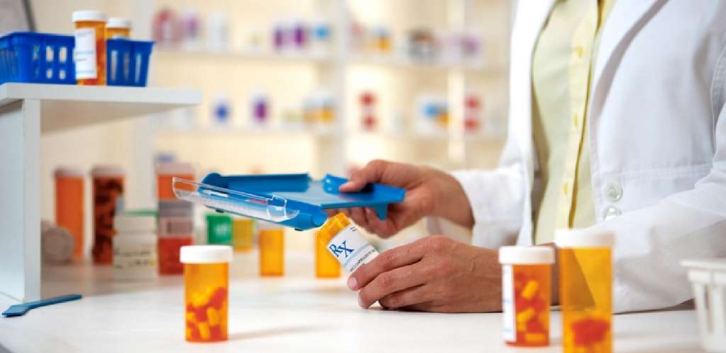 pharmacist checking medicine