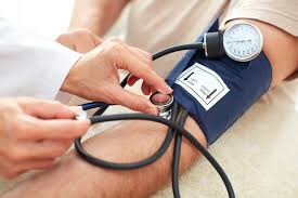 man taking blood pressure test