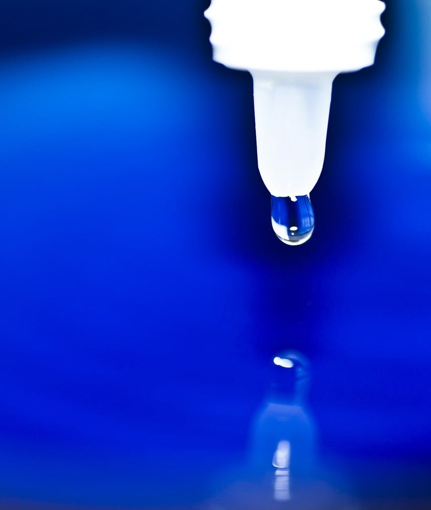 eye drop on blue background