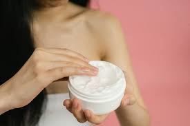 woman applying cream