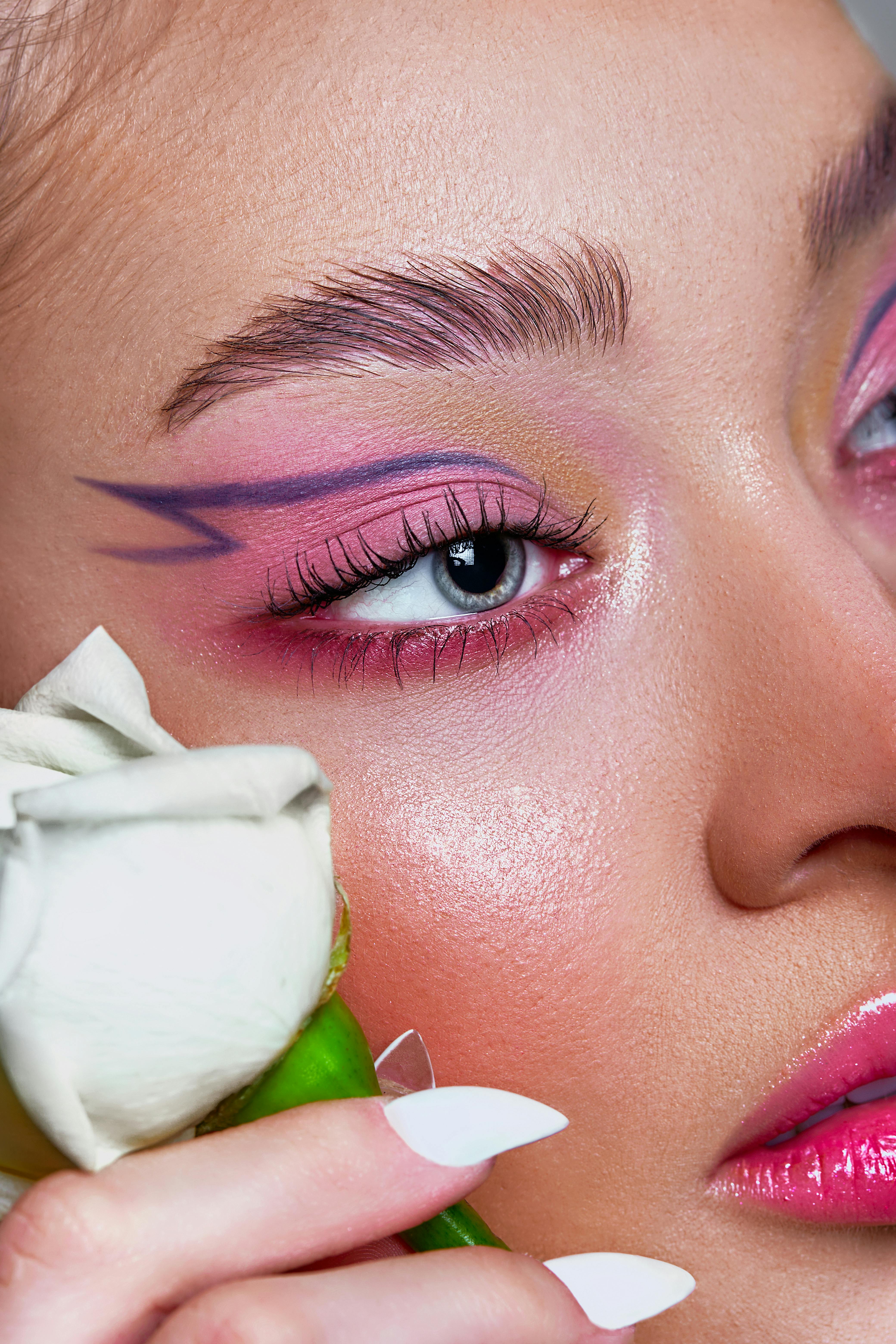 face with violet and pink makeup
