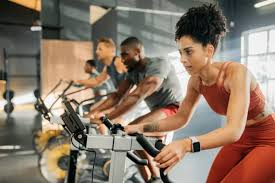 woman exercising on bike