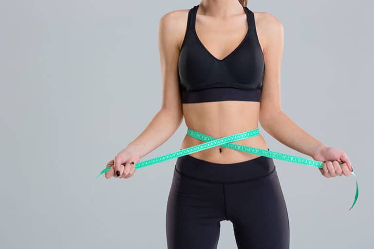 woman measuring waist