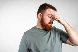 person with nausea hand on mouth