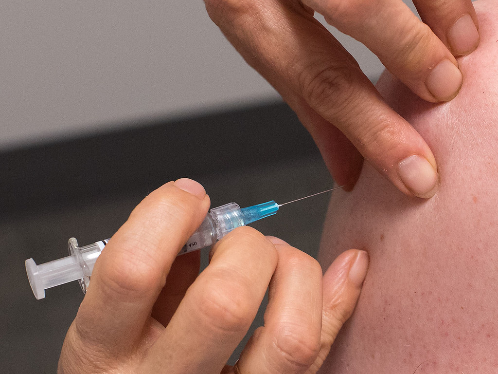 administering injection
