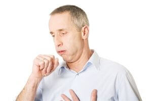 man coughing