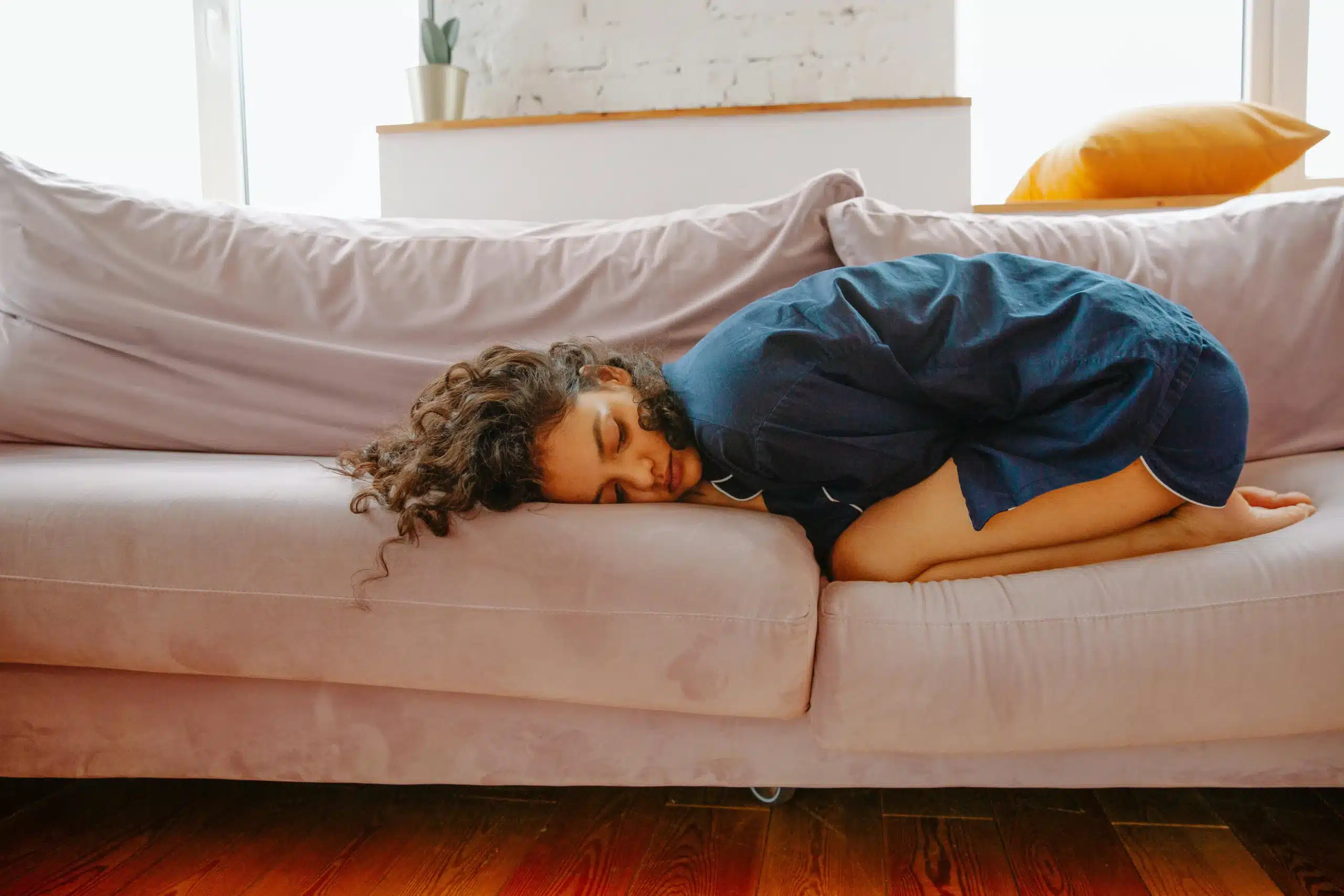 woman laying down on the sofa